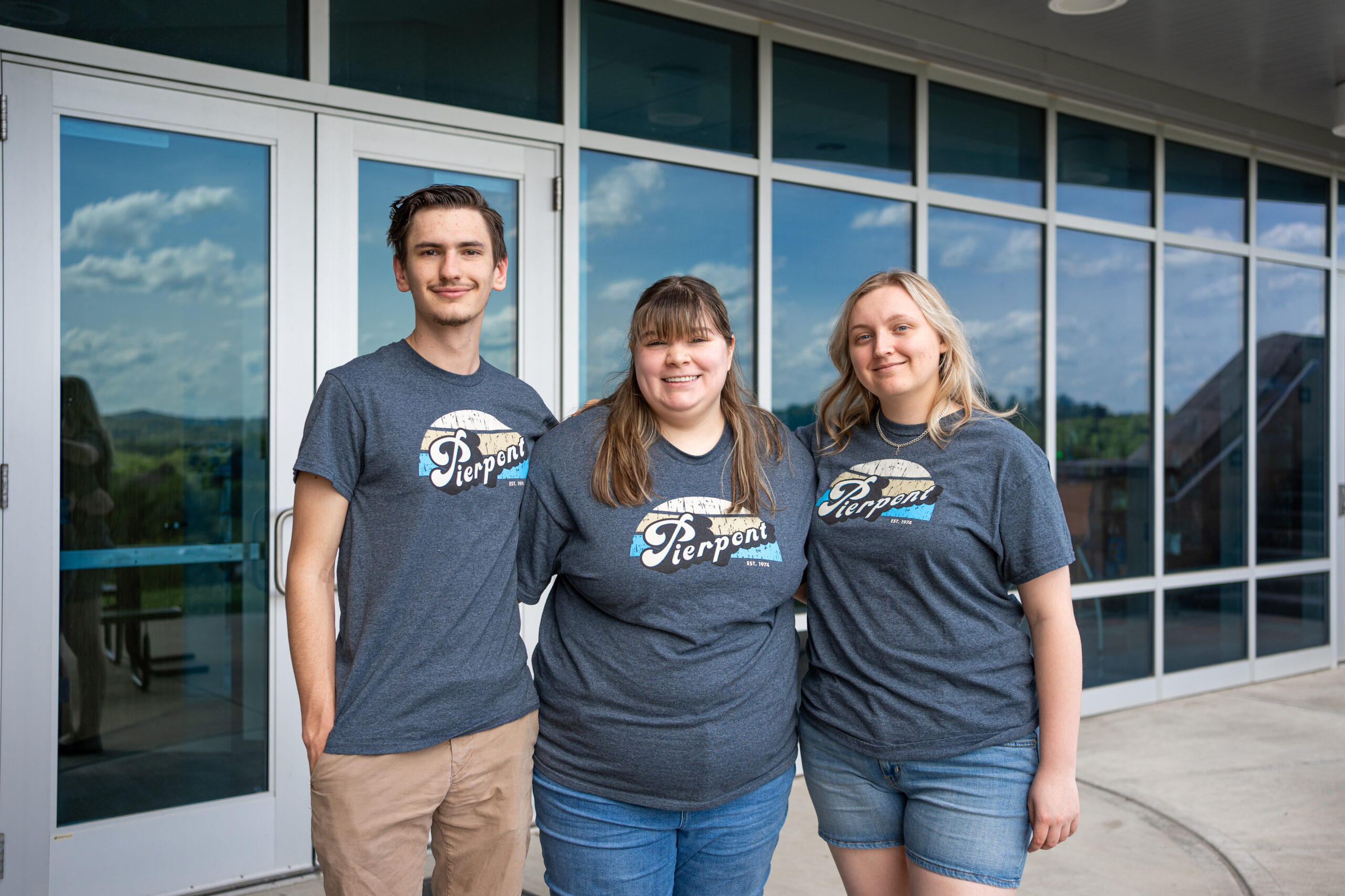 Pierpont's new SGA leadership are pictured standing in front of a wall of windows.