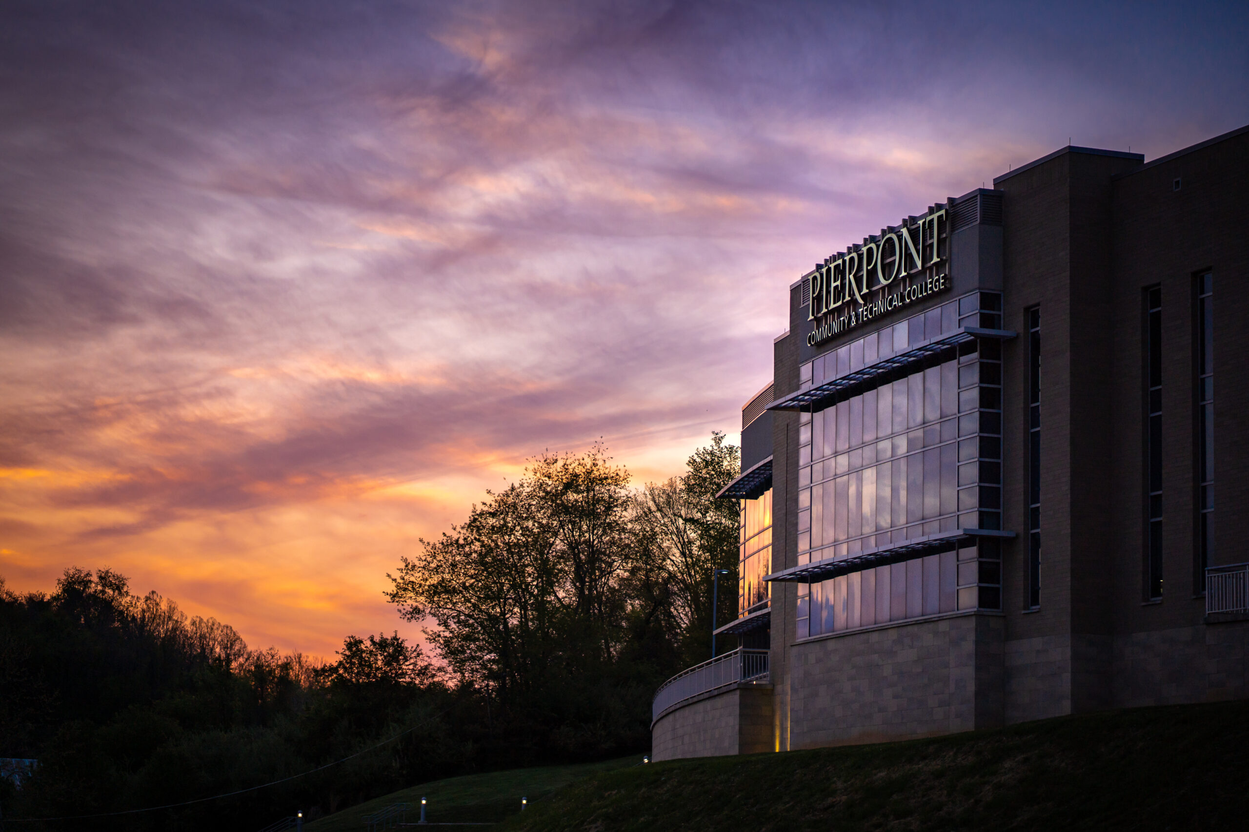 An image of Pierpont's Advanced Technology Center with a sunset.