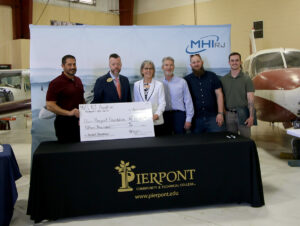 MHIRJ donates $15,000 to the Pierpont Community & Technical College’s Aviation Maintenance Program. Pictured, from left, Michael Genin, Director of Operations at MHIRJ; Dr. Michael Waide, Interim President at Pierpont Community & Technical College; Kathy Hypes, Director at the Pierpont Foundation; Dr. Brad Gilbert, Director of Aviation at Pierpont Community & Technical College; and two students within the Aviation Maintenance Technology program, Nathan Keener and Jacob O'hern.