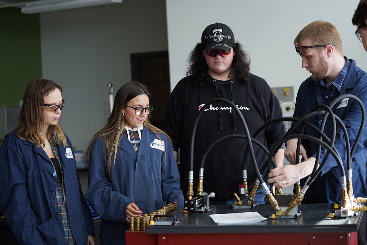 Blake Lillard, assistant professor and program coordinator of Applied Process Technology at Pierpont Community and Technical College, teaches students about hydraulics.