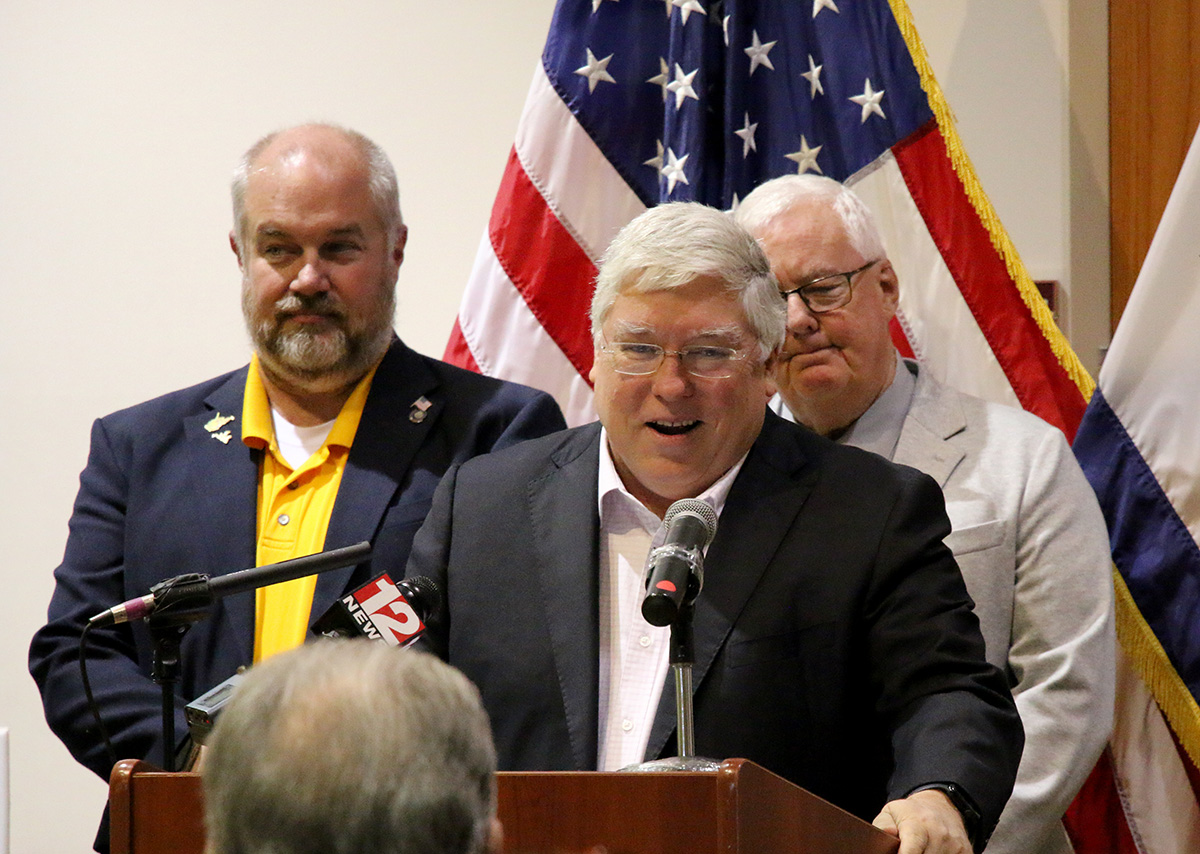 Gov. Patrick Morrisey addresses community at a press conference.