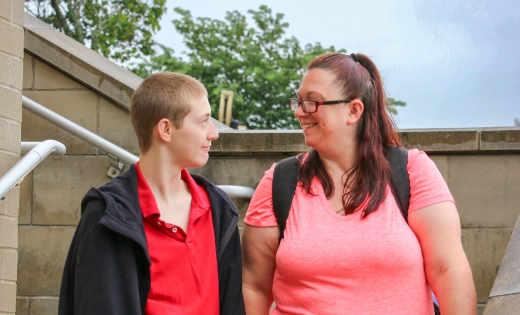 A Pierpont Student and her son pose for a photo together
