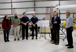From left: Pierpont Foundation Chairperson Natalie Tennant; Pratt & Whitney Engine Services Finance Manager/Controller Brian Bozarth; General Manager John Cowan; Facilities and Services Manager and Pierpont Board of Governors member Nathan Weese; Pierpont Foundation Director Kathy Hypes; Pierpont Interim President Dr. Michael Waide; and Aviation Maintenance Technology Program Director Brad Gilbert gather for a $15,000 check presentation at the Robert C. Byrd National Aerospace Education Center in Bridgeport, W.Va., on Nov. 10, 2025.