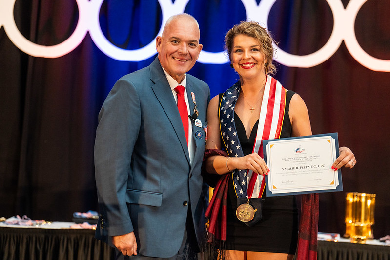 Natalie Feltz (left), Associate Professor and Program Coordinator for Food Service Management at Pierpont Community & Technical College, receives the American Culinary Federation President's Medal from Rene Marquis, ACF National President, during the Presidential Banquet at the 2026 American Culinary Federation National Convention in Grand Rapids, Michigan.